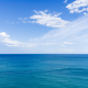 sea and clear blue sky with clouds